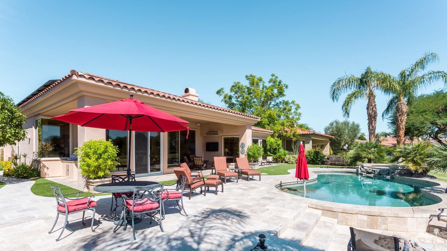 314 Loch Lomond Road Rancho Mirage, CA 92270 - Photo 47 of 48 a view of a chair and table in patio with a fire pit