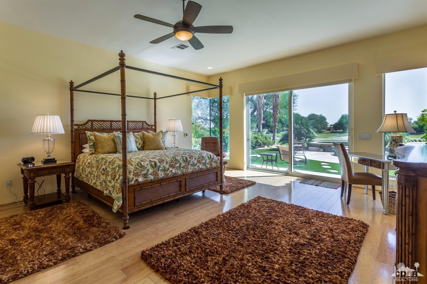 314 Loch Lomond Road Rancho Mirage, CA 92270 - Photo 5 of 48 a bedroom with a bed window and a table