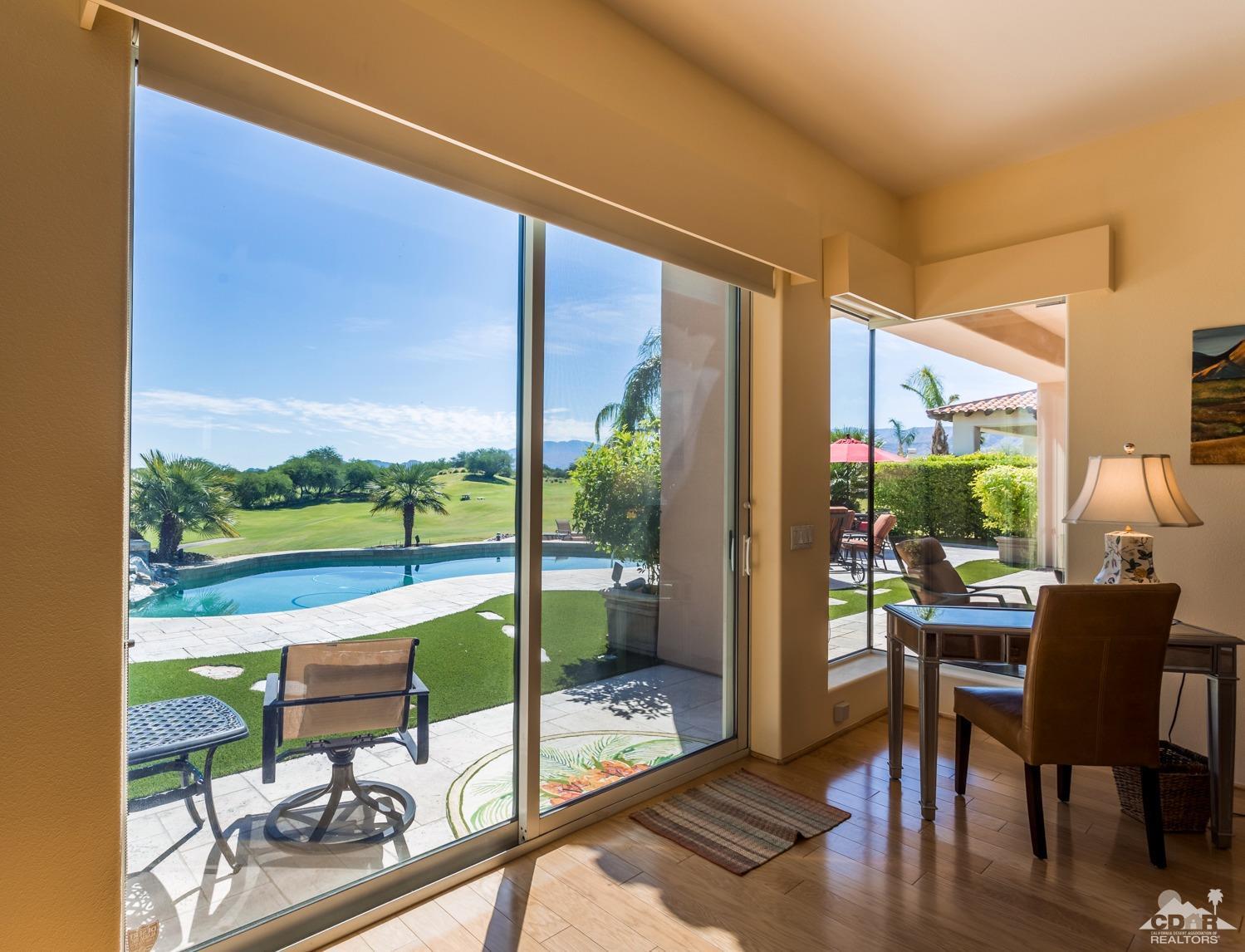 314 Loch Lomond Road Rancho Mirage, CA 92270 - Photo 6 of 48 a room with furniture and a floor to ceiling window
