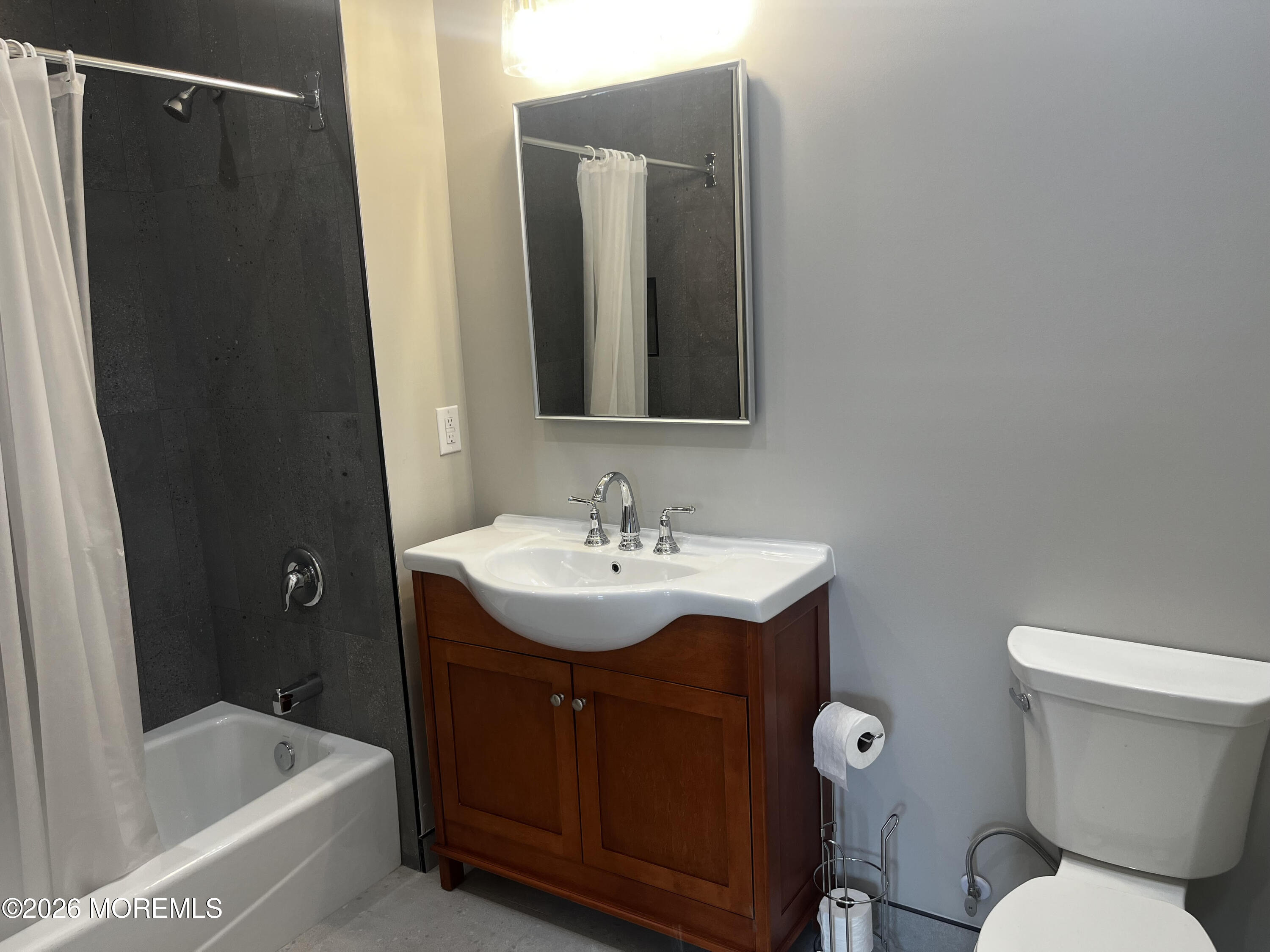 2419 Bridge Avenue, Unit 203 Point Pleasant, NJ 08742 - Photo 4 of 8 a bathroom with a sink and a toilet