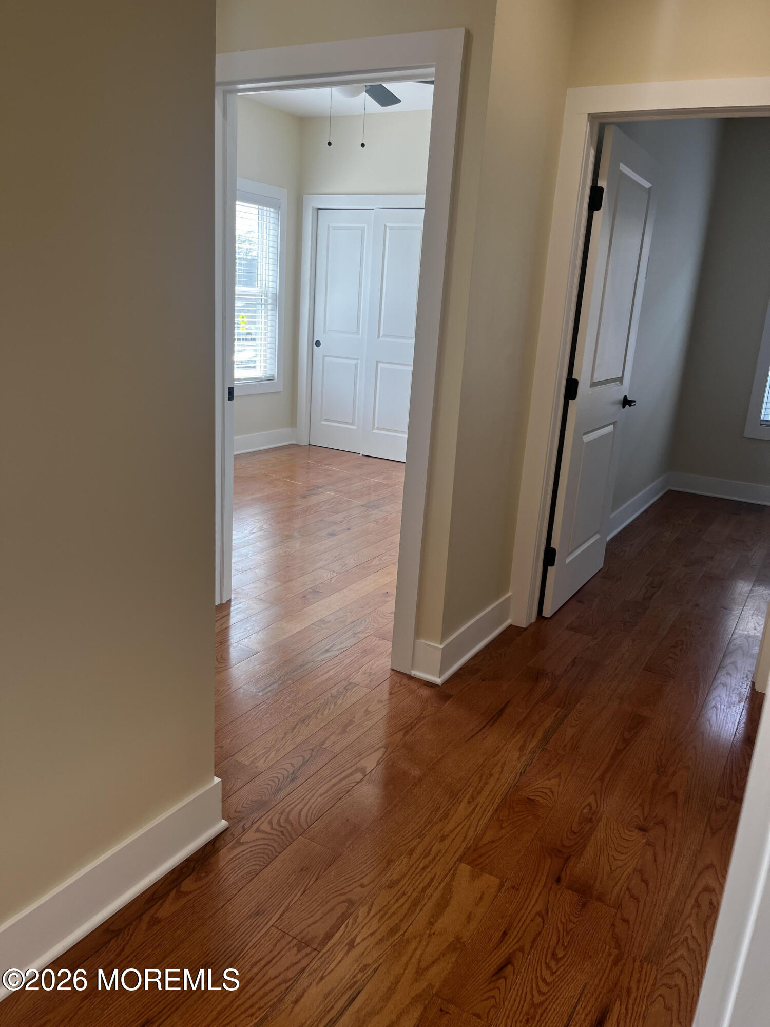 2419 Bridge Avenue, Unit 203 Point Pleasant, NJ 08742 - Photo 5 of 8 a view of a hallway with wooden floor