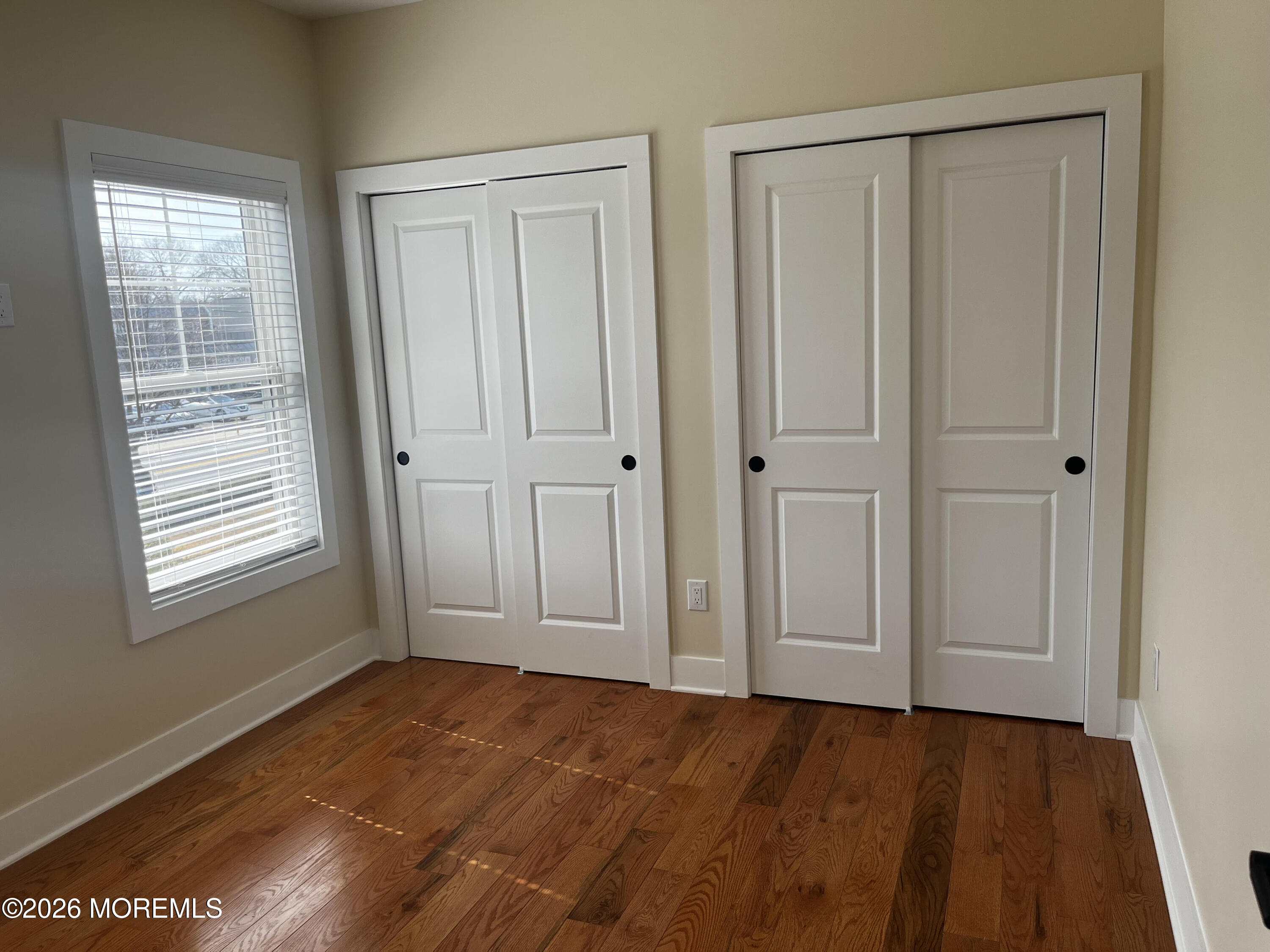 2419 Bridge Avenue, Unit 203 Point Pleasant, NJ 08742 - Photo 6 of 8 a view of an empty room and window