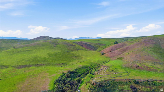 2075 Canyon Road Smithfield, UT 84335 - Photo 2 of 18 Expansive rolling hills featuring verdant grasslands and distant mountains