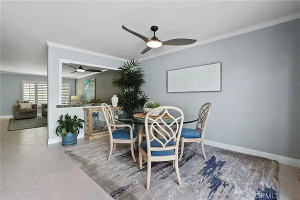 a dining room with furniture and window