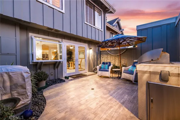a view of a chairs and tables in patio of the house