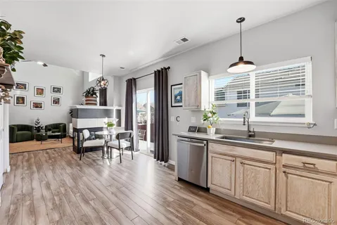 a very nice looking living room with wooden floor and furniture