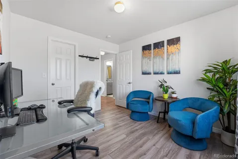 a workspace with furniture and a potted plant
