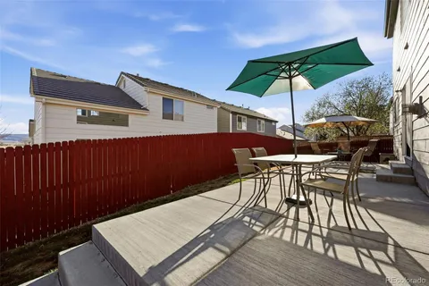 a view of a backyard with sitting area and furniture