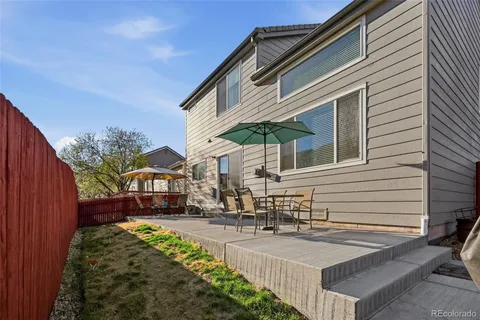 a view of a house with a yard and garage