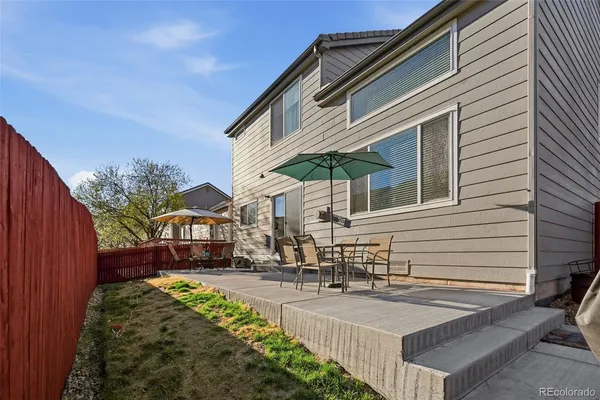a view of a house with a yard and garage