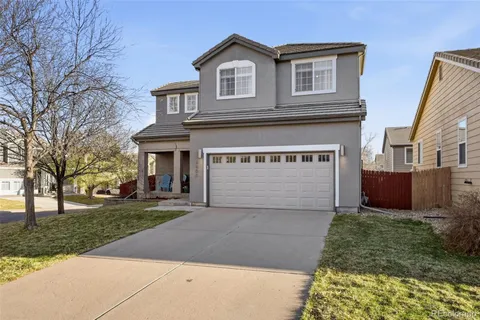 a front view of a house with yard