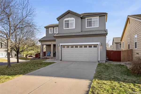 a front view of a house with yard