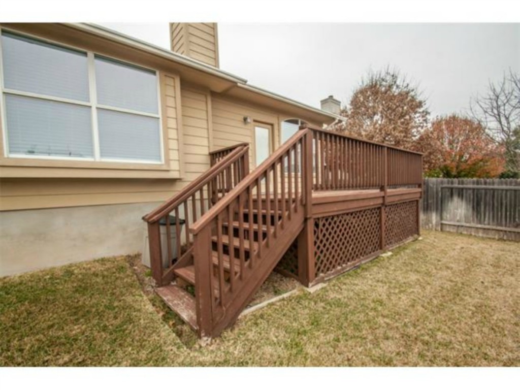 833 Rusk Road Round Rock, TX 78665 - Photo 13 of 15 a view of a house with wooden floor roof and deck