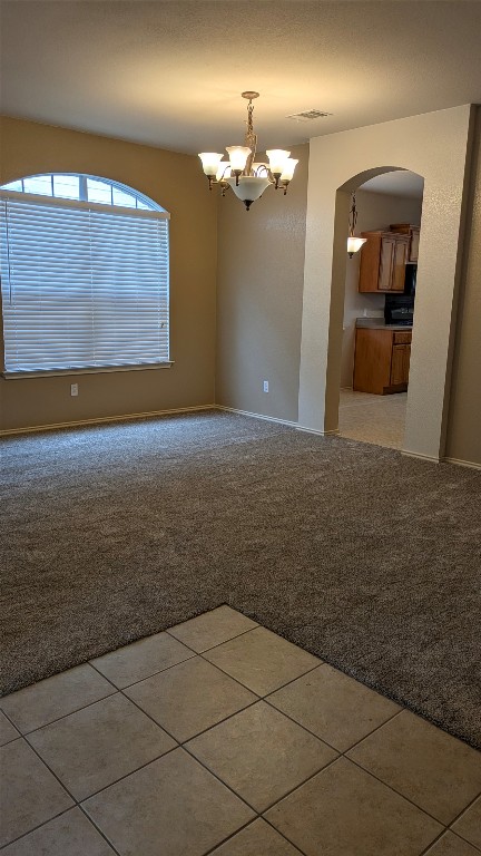 833 Rusk Road Round Rock, TX 78665 - Photo 3 of 15 a view of a livingroom with a chandelier