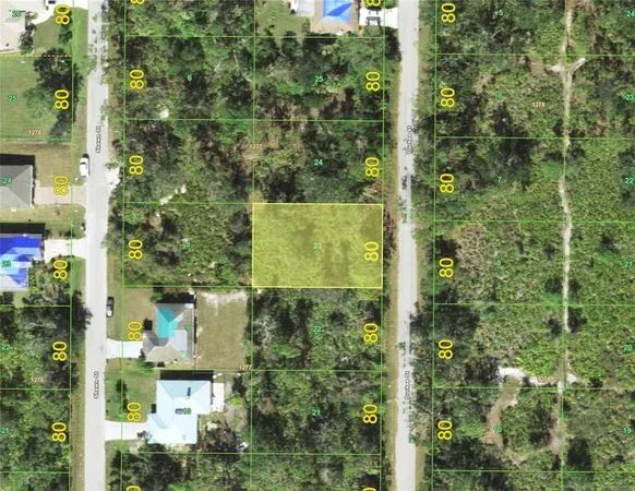 an aerial view of houses with yard