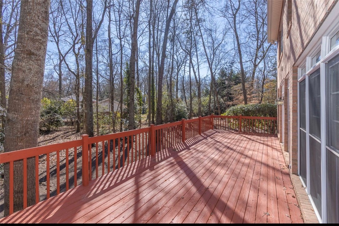 1104 Thornehill Drive Anderson, SC 29621 - Photo 11 of 35 This spacious wood deck offers peaceful tree views, perfect for outdoor enjoyment.