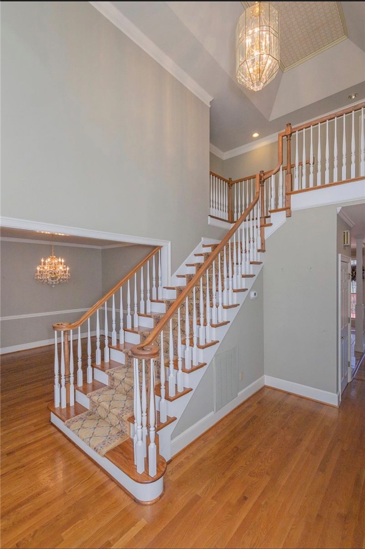 1104 Thornehill Drive Anderson, SC 29621 - Photo 14 of 35 Elegant hardwood flooring flows seamlessly through this grand entryway with a sweeping staircase.
