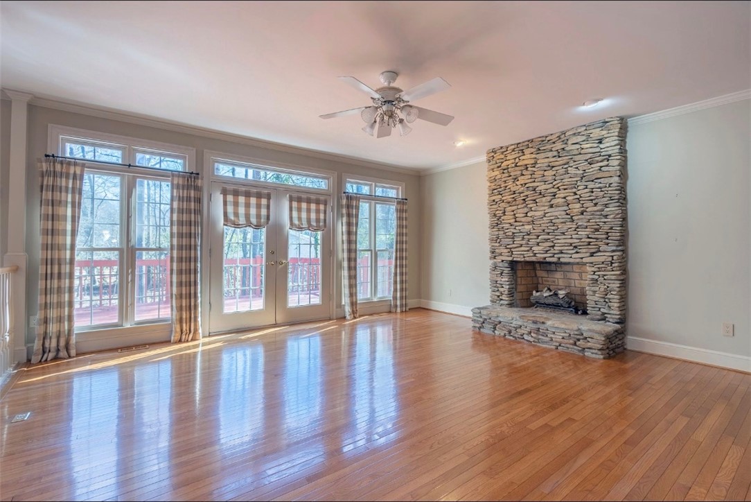 1104 Thornehill Drive Anderson, SC 29621 - Photo 16 of 35 This expansive living space features hardwood floors, a stone fireplace, and abundant natural light.