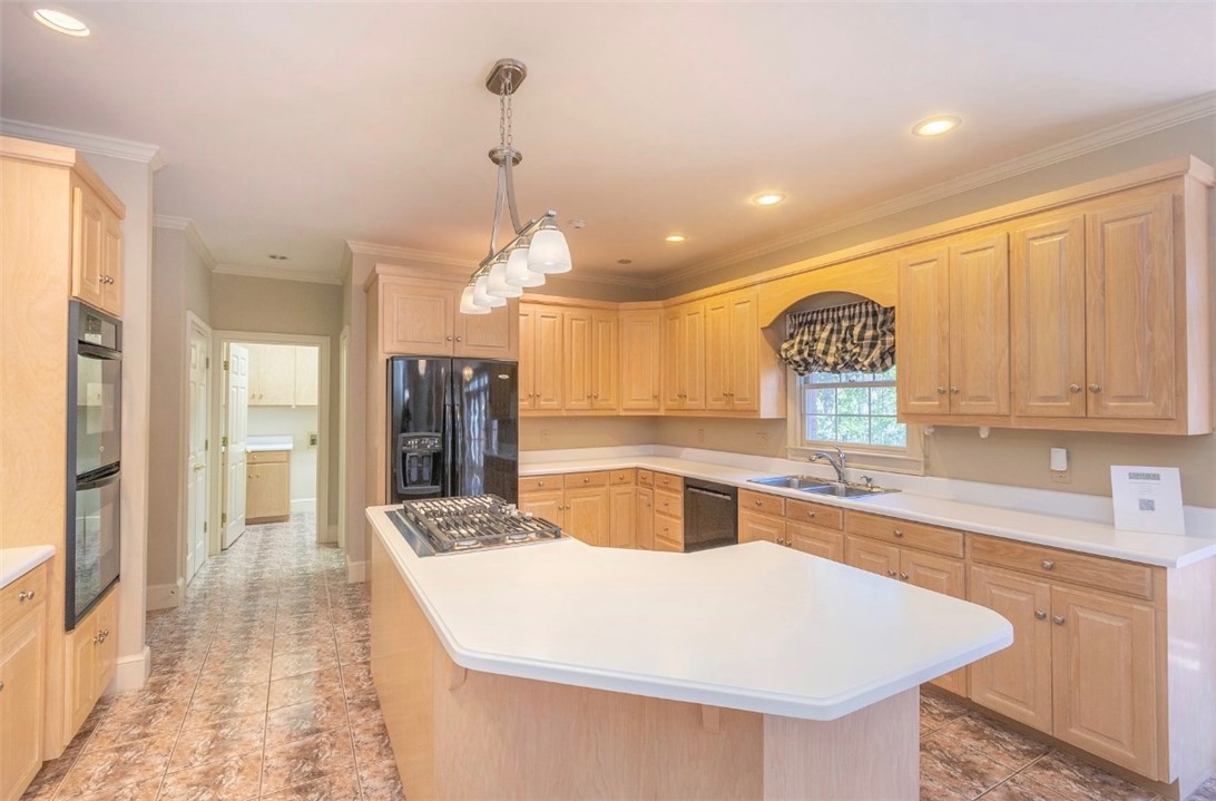 1104 Thornehill Drive Anderson, SC 29621 - Photo 22 of 35 This kitchen features abundant cabinetry, a central island, and modern appliances for daily living.