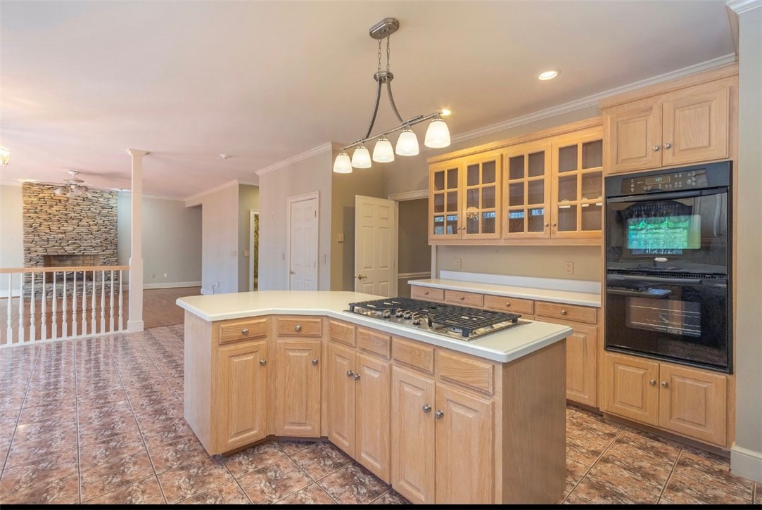 1104 Thornehill Drive Anderson, SC 29621 - Photo 23 of 35 This spacious kitchen offers a central island with cooktop, double ovens, and tile flooring.