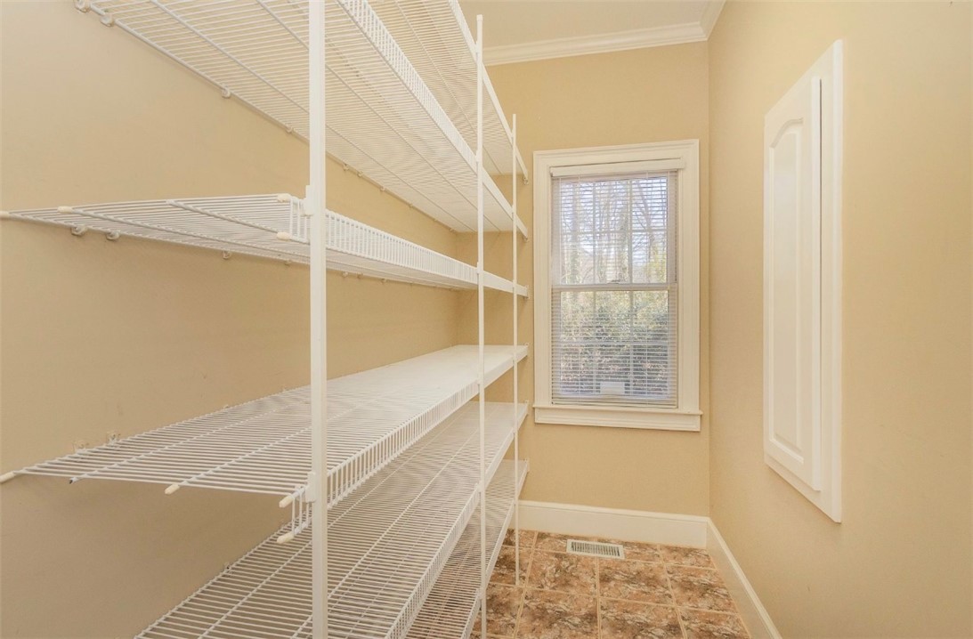 1104 Thornehill Drive Anderson, SC 29621 - Photo 24 of 35 Functional pantry featuring wire shelving and natural light for organized storage.