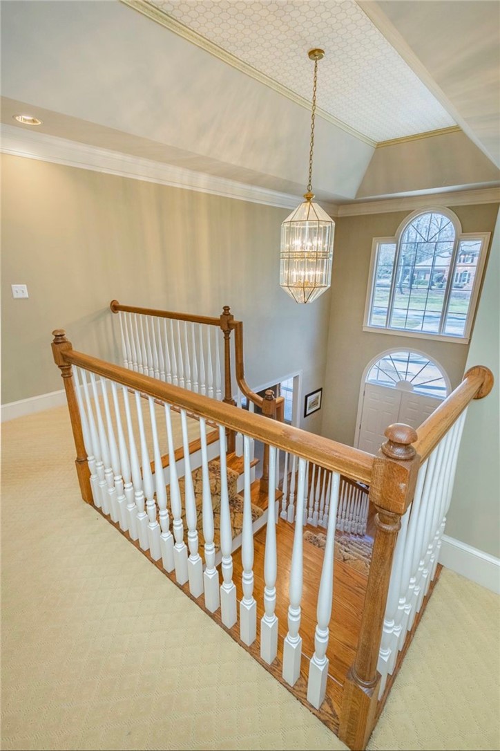 1104 Thornehill Drive Anderson, SC 29621 - Photo 26 of 35 This grand entryway features a multi-story staircase, an elegant chandelier, and a large arched window.