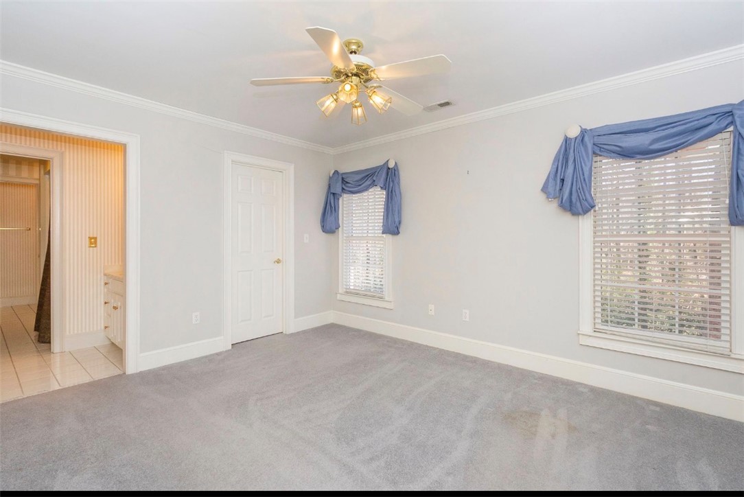1104 Thornehill Drive Anderson, SC 29621 - Photo 33 of 35 This inviting bedroom features soft carpeting and ample natural light, creating a comfortable living space.