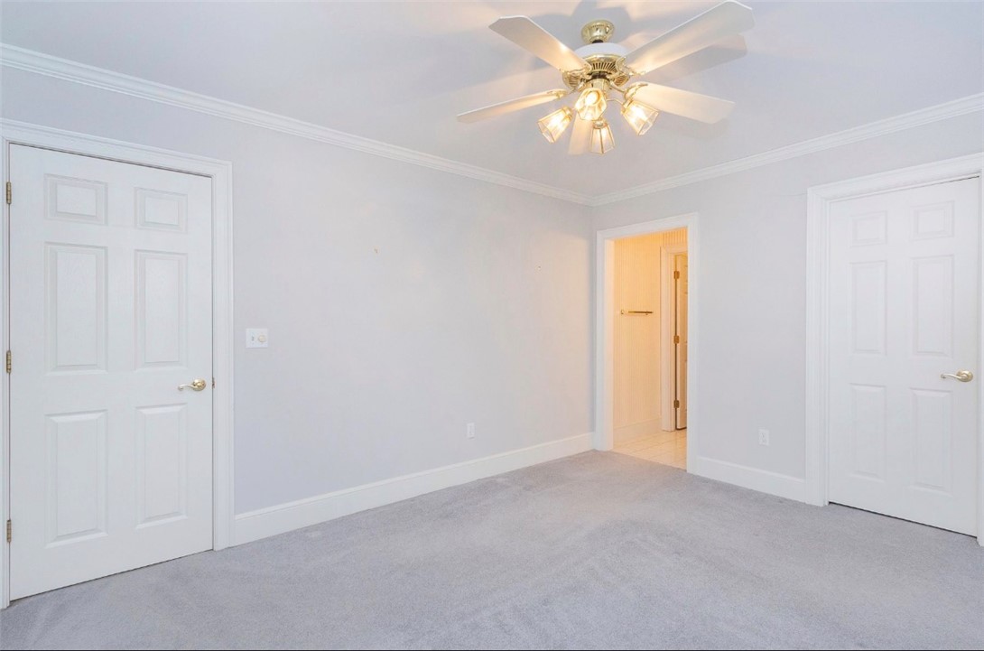 1104 Thornehill Drive Anderson, SC 29621 - Photo 34 of 35 This airy bedroom offers a comfortable retreat with a neutral palette and soft carpeting.