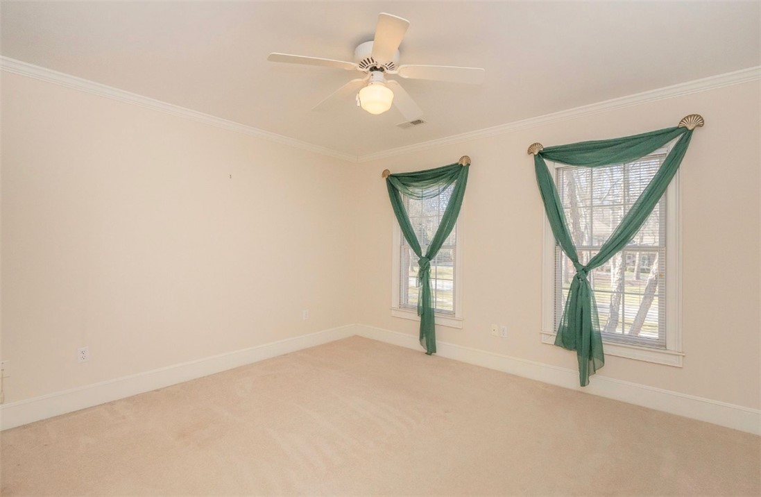 1104 Thornehill Drive Anderson, SC 29621 - Photo 35 of 35 This spacious bedroom offers ample natural light and comfortable carpeting, perfect for peaceful living.