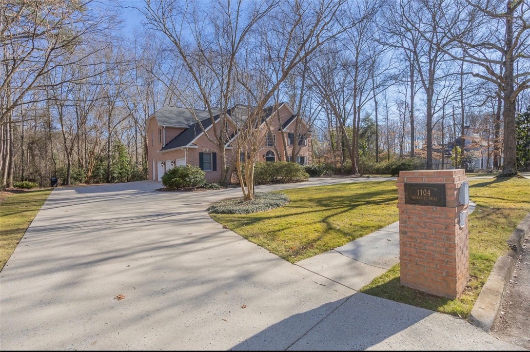 1104 Thornehill Drive Anderson, SC 29621 - Photo 5 of 35 This classic brick residence features an attached garage and a spacious concrete driveway.
