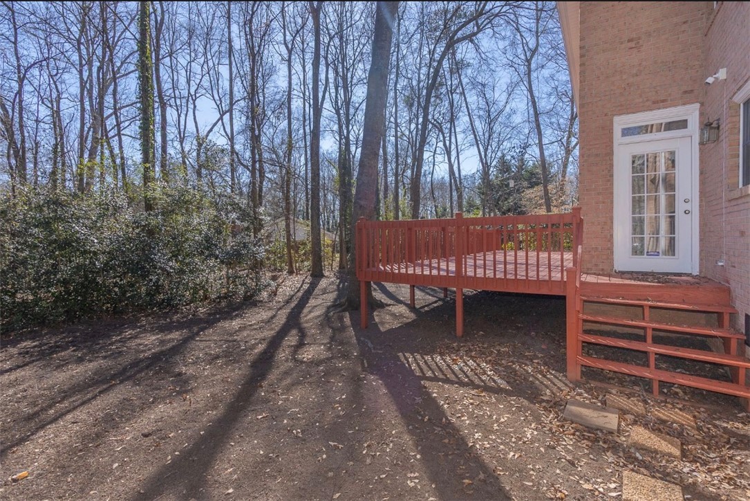 1104 Thornehill Drive Anderson, SC 29621 - Photo 10 of 35 Step outside onto this private deck, perfect for entertaining or quiet relaxation amidst nature.