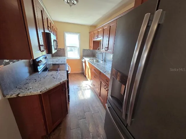 a bathroom with sink and mirror