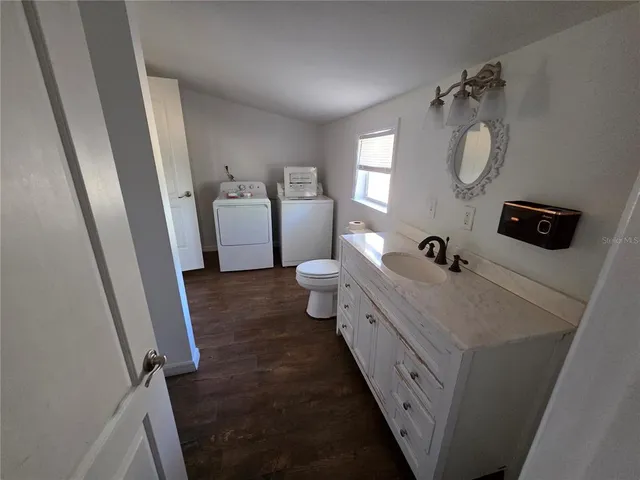 a bathroom with a double vanity sink and mirror