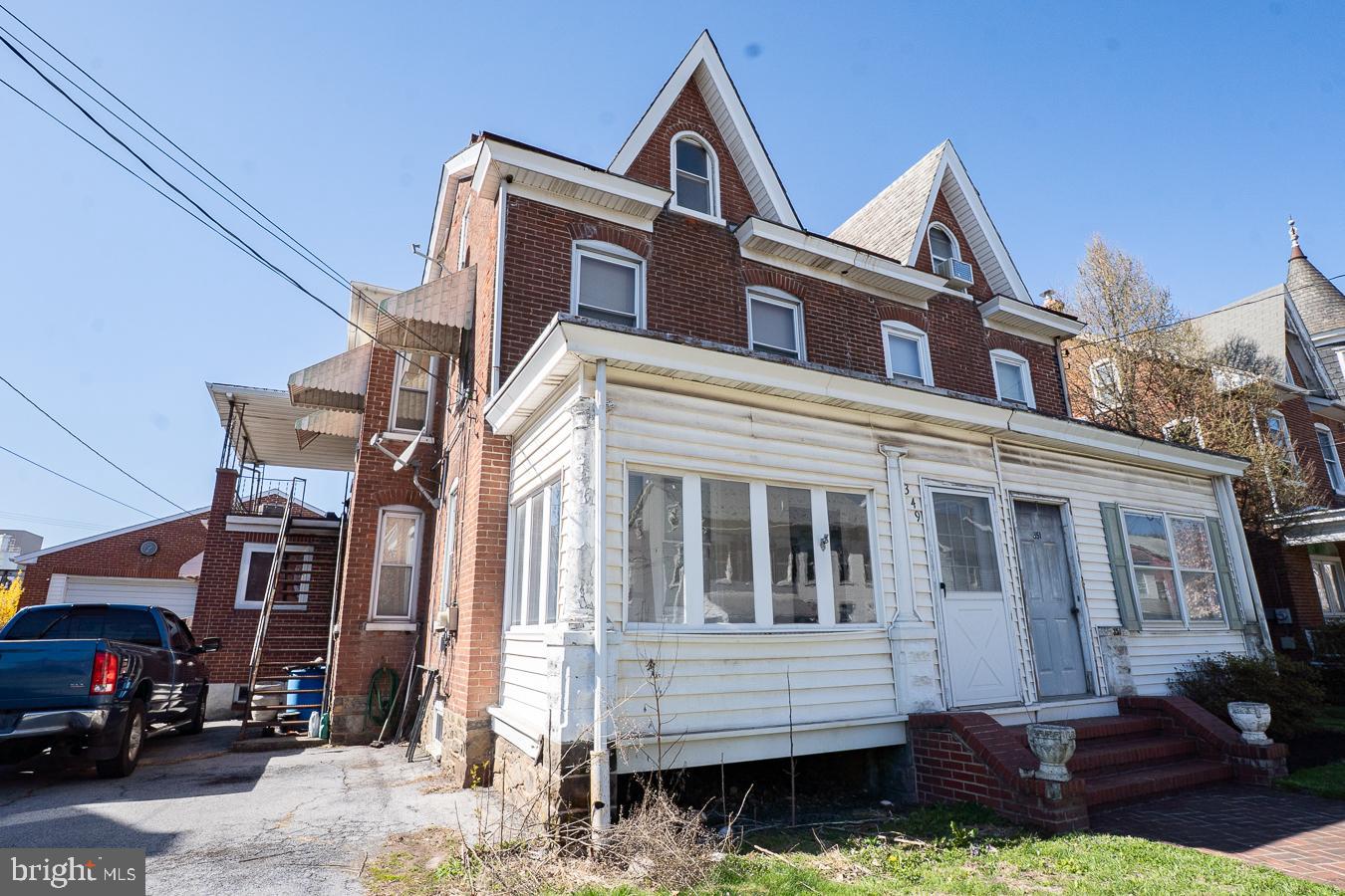 349 Reading Boyertown, PA 19512 - Photo 2 of 24 a front view of a house with a yard