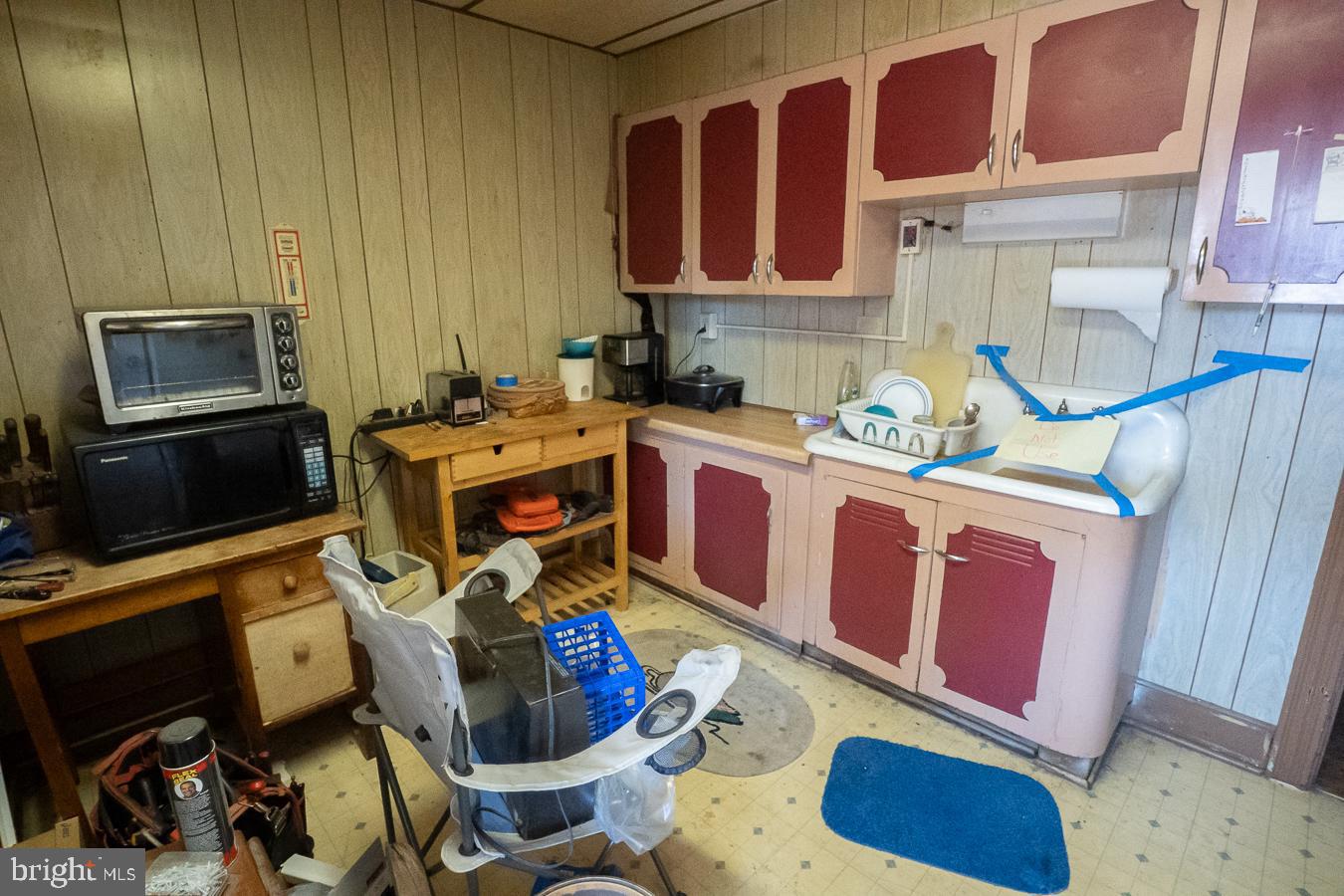 349 Reading Boyertown, PA 19512 - Photo 21 of 24 a kitchen with stainless steel appliances granite countertop a stove a sink dishwasher and cabinets with wooden floor