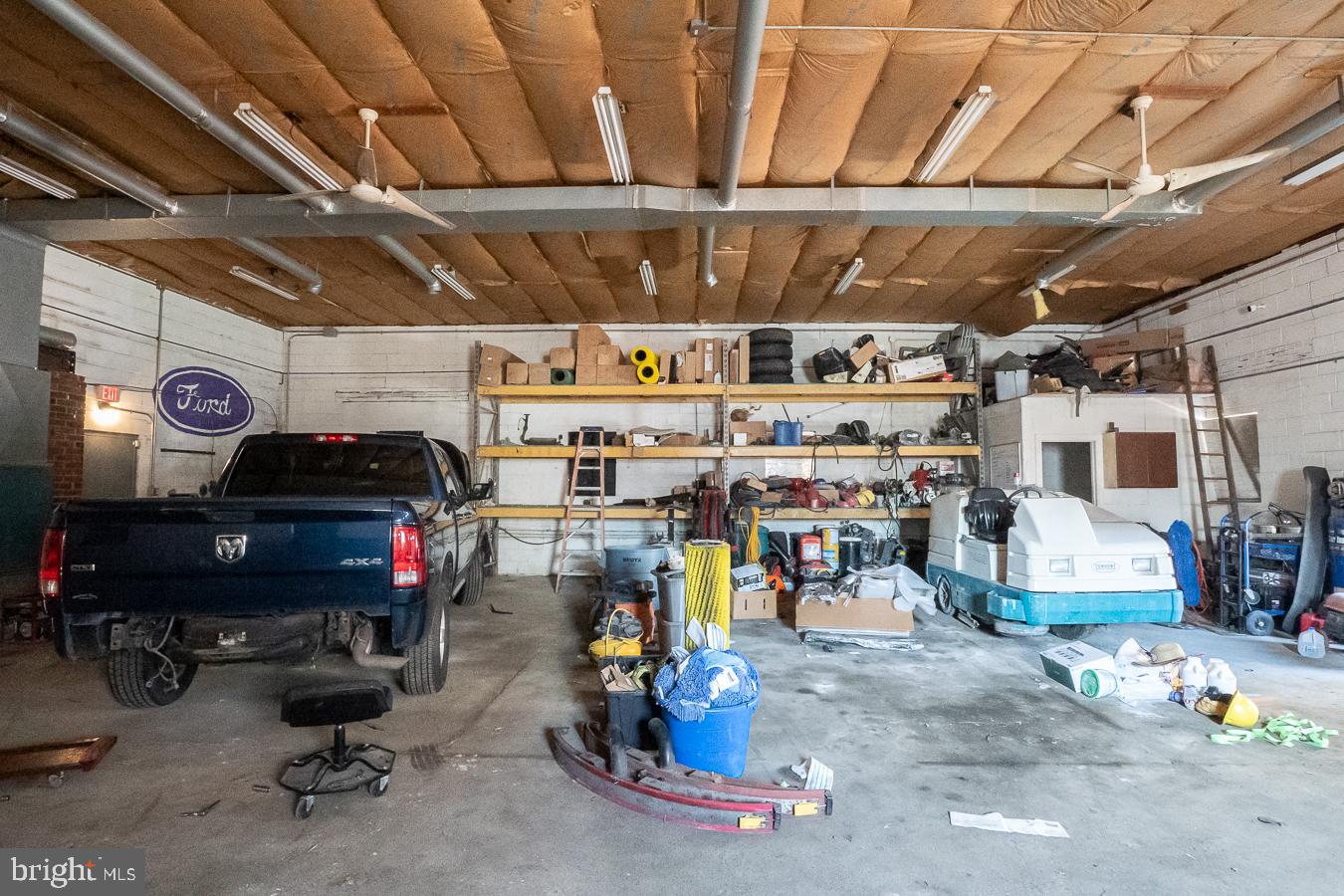 349 Reading Boyertown, PA 19512 - Photo 24 of 24 a view of a garage with a bike and wooden roof
