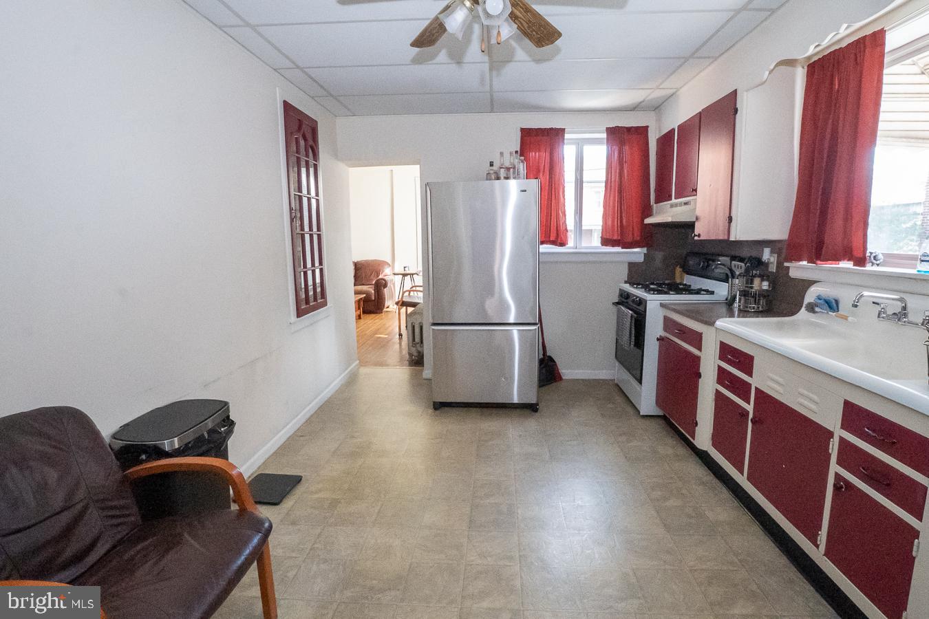 349 Reading Boyertown, PA 19512 - Photo 5 of 24 a kitchen with refrigerator a microwave and furniture