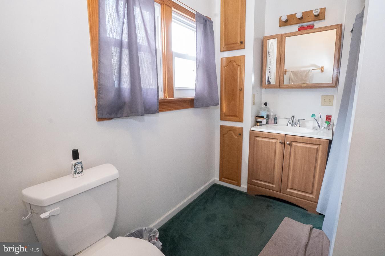 349 Reading Boyertown, PA 19512 - Photo 8 of 24 a bathroom with a toilet a sink and a window