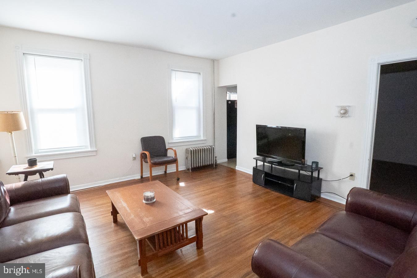 349 Reading Boyertown, PA 19512 - Photo 10 of 24 a living room with furniture and a flat screen tv