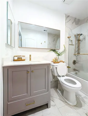 a bath tub sitting next to a bathroom sink