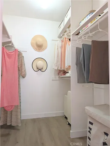 a view of a room with window and hardwood floor