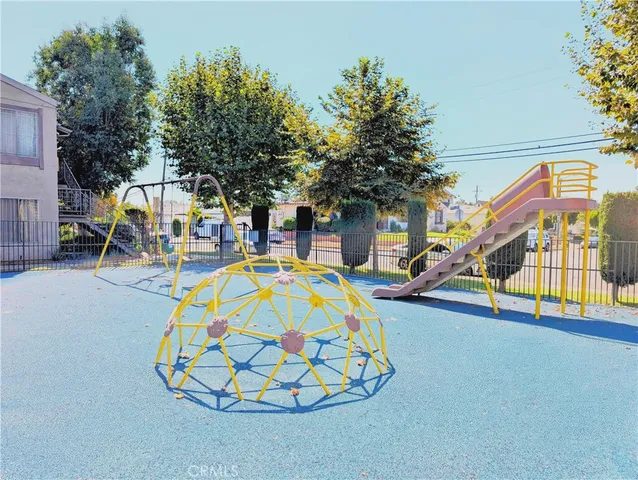 a view of a house with a swimming pool and a yard