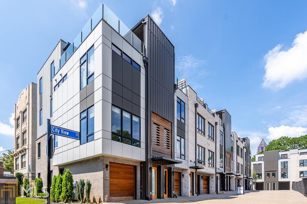 626 Parkway Drive Northeast, Unit 3 Atlanta, GA 30308 - Photo 1 of 1 a view of a building along a street