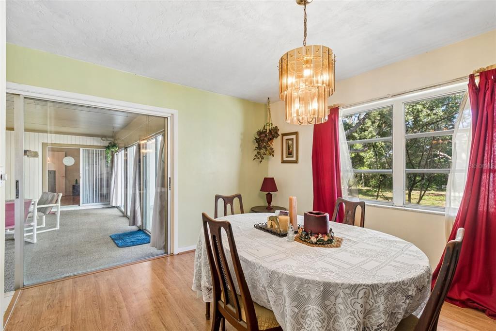 2059 Waterfall Drive Spring Hill, FL 34608 - Photo 11 of 26 a view of a dining room with furniture window and outside view