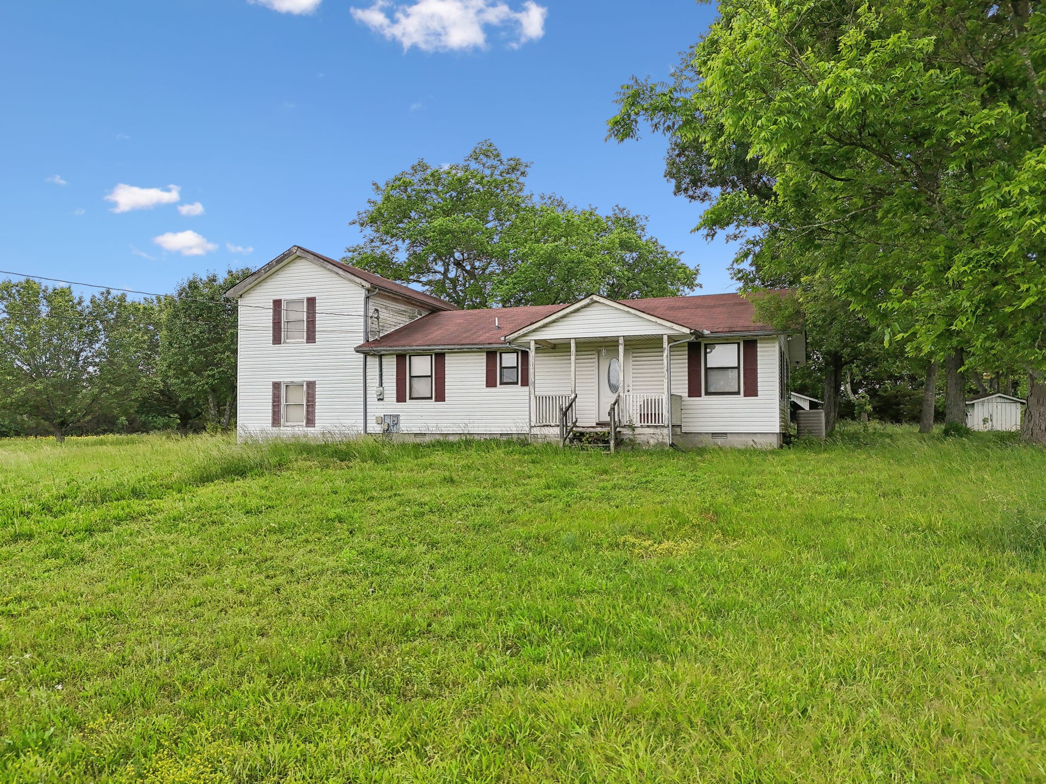 8076 Newtown Road Rockvale, TN 37153 - Photo 1 of 22 a view of a house with a backyard