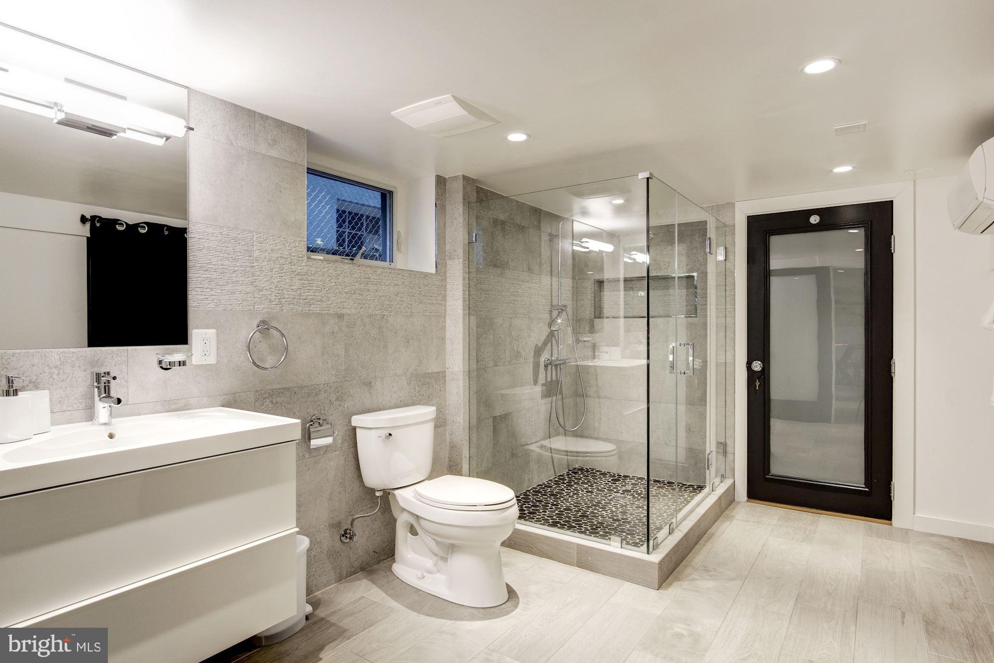 3309 Woodley Road Northwest Washington, DC 20008 - Photo 44 of 59 Large renovated bath w/Porcelanosa tile