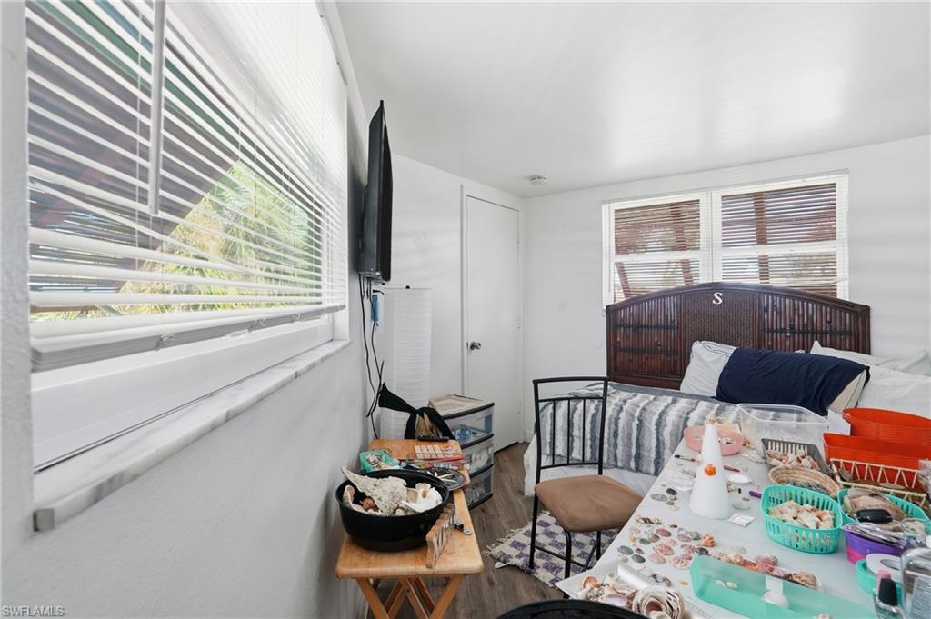 5431 Oak Ridge Avenue Fort Myers Beach, FL 33931 - Photo 22 of 33 a living room with furniture and a large window