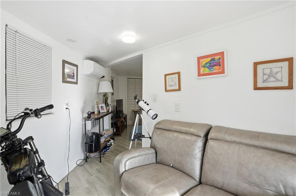 5431 Oak Ridge Avenue Fort Myers Beach, FL 33931 - Photo 8 of 33 a living room with furniture and a flat screen tv