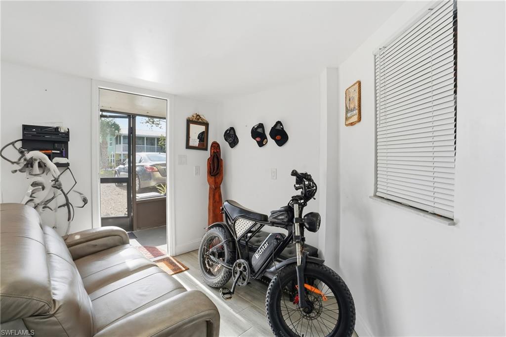 5431 Oak Ridge Avenue Fort Myers Beach, FL 33931 - Photo 9 of 33 a view of a livingroom with furniture and a window