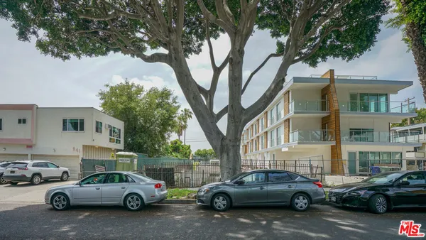 a view of a cars parked in front of a building